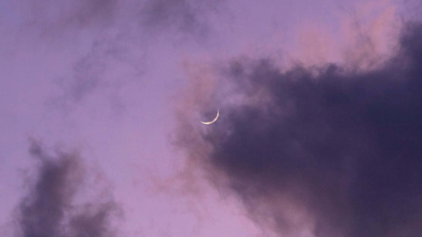 A Crescent Is Seen In The Sky Wallpaper
