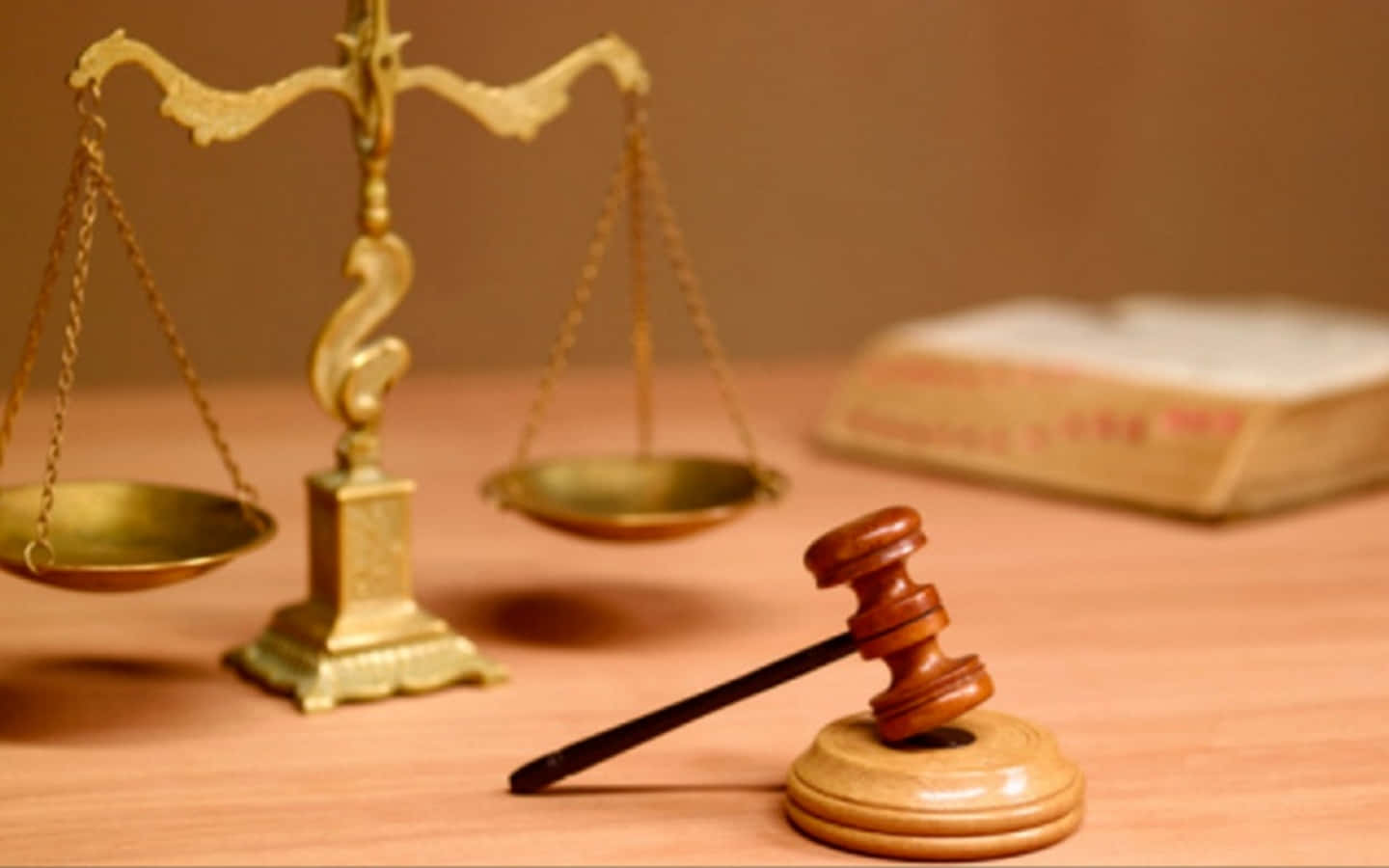 A Wooden Scale And A Gavel On A Table