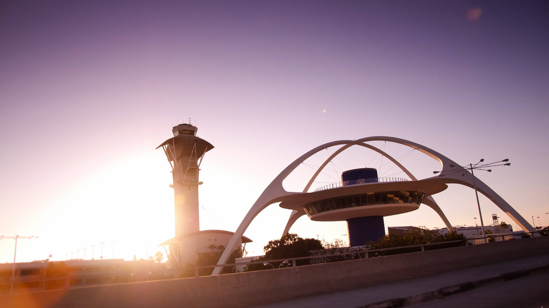 The famous Los Angeles Theme Building at LAX, illuminated by the morning sun Wallpaper