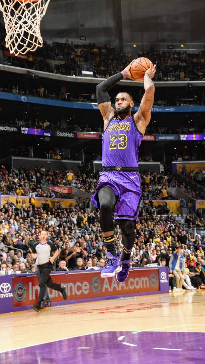 Le Bron_ James_ Soaring_ Dunk_ Lakers Wallpaper