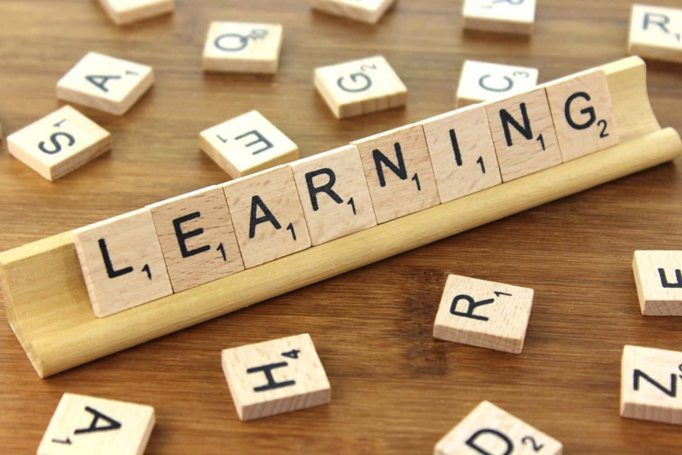 Learning Is A Word Spelled Out In Wooden Blocks