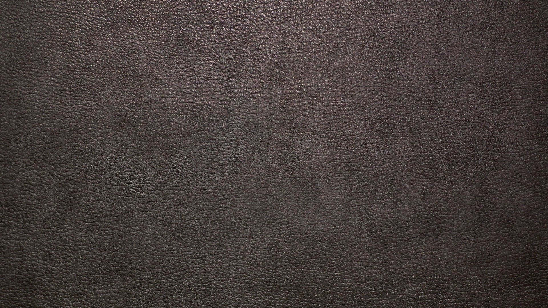 Ennärbild Av En Mörkbrun Läderbakgrund.