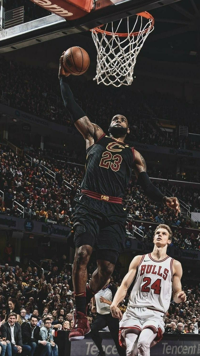 LeBron James Stuns Crowd with a Spectacular Slam Dunk Wallpaper