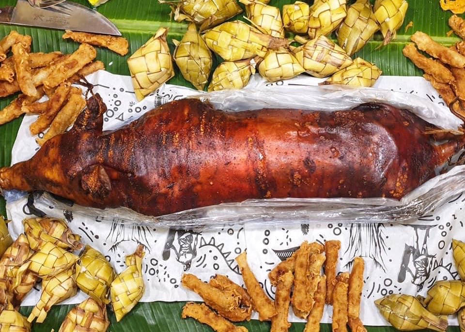 Lechon On Table With Leaves Wallpaper