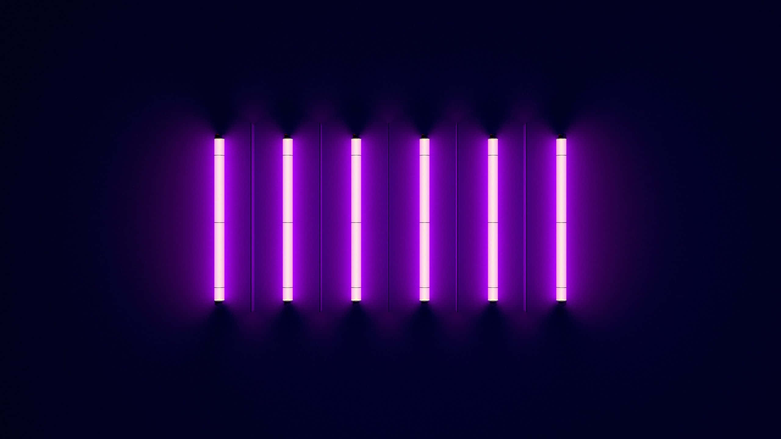 A Purple Light Is Shown On A Dark Background