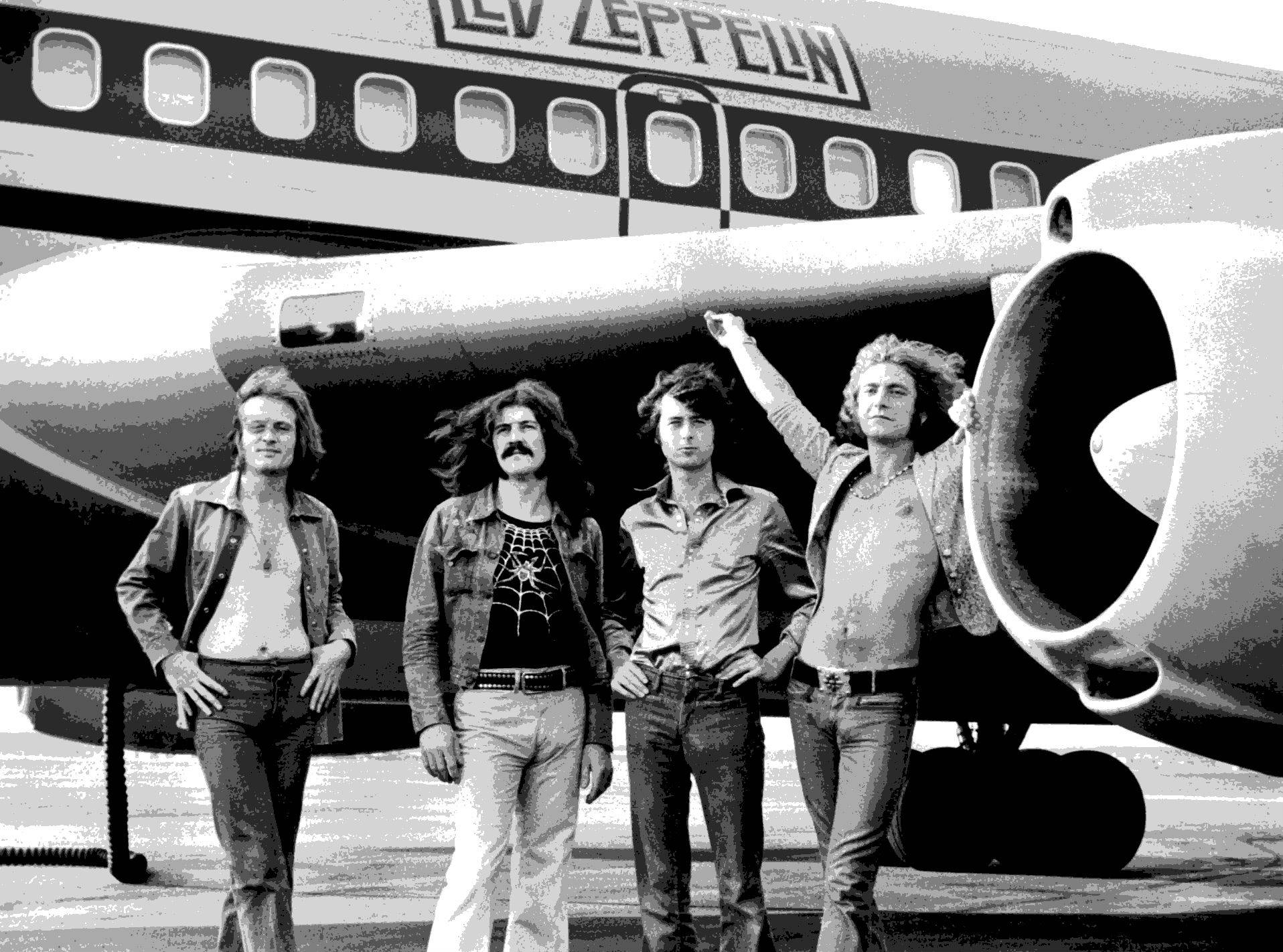 Led Zeppelin Besides An Airplane Picture