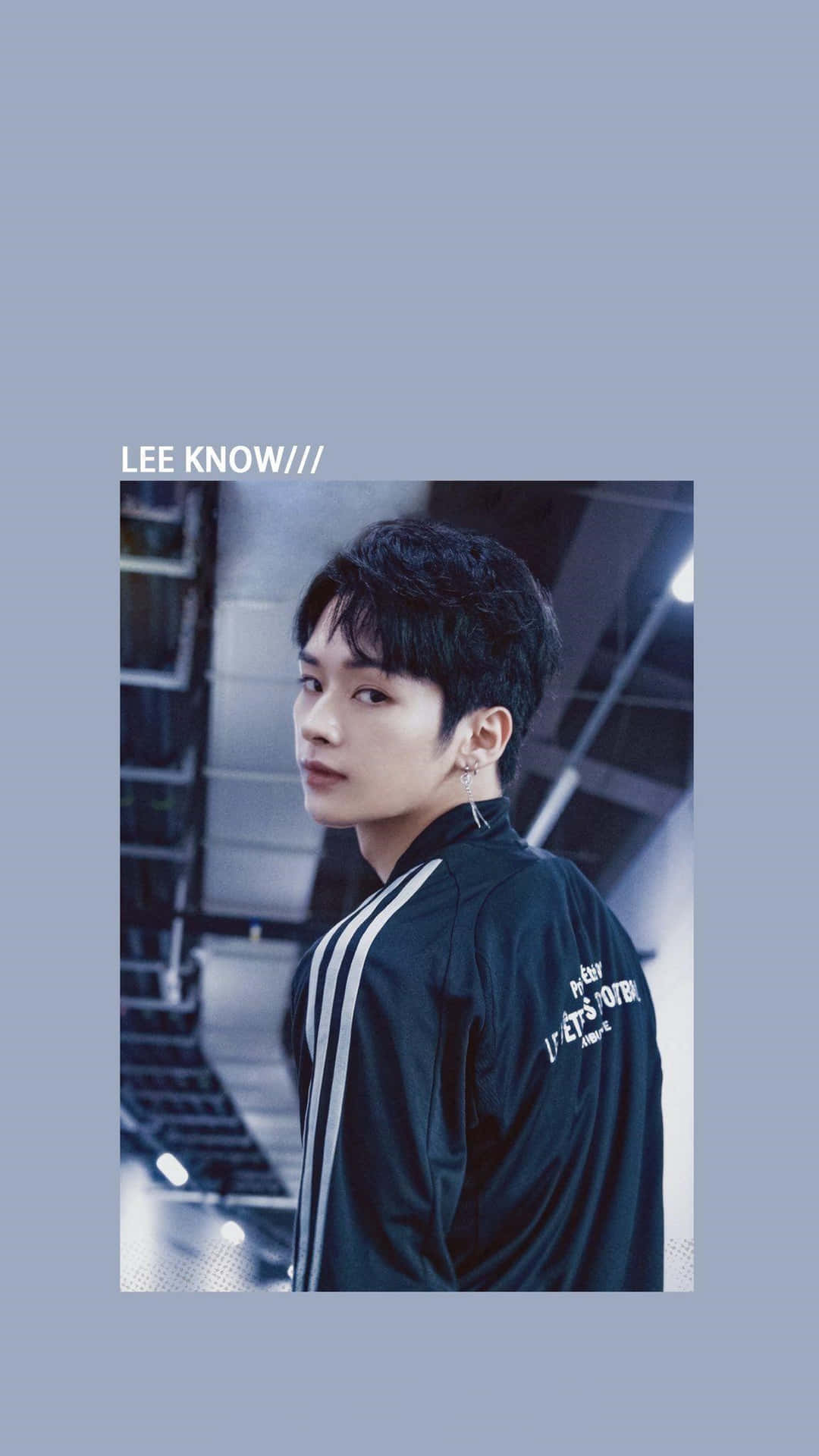 Lee Know Cool Stare Staircase Backdrop Wallpaper