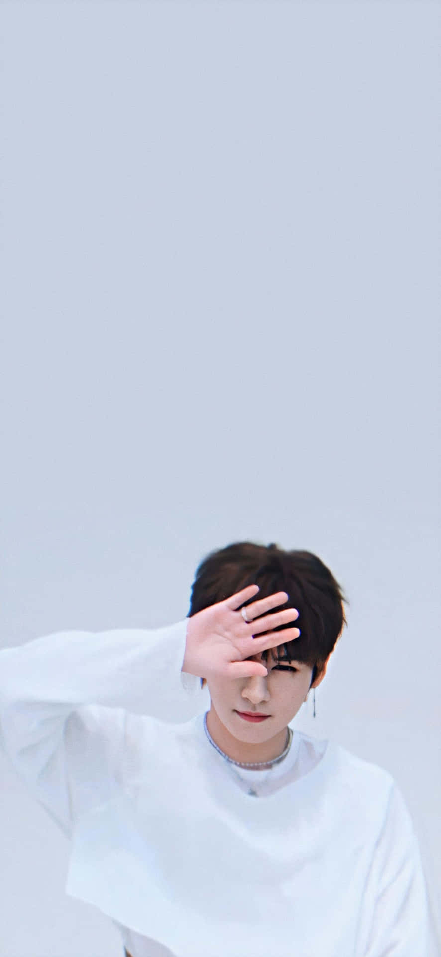 Lee Know Hand Covering Face Pose Wallpaper