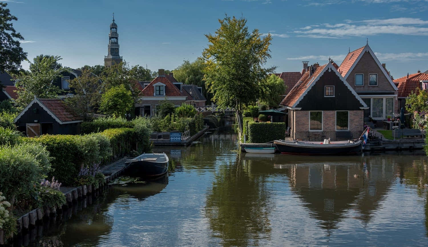 Download Leeuwarden Canal Viewwith Historic Tower Wallpaper ...