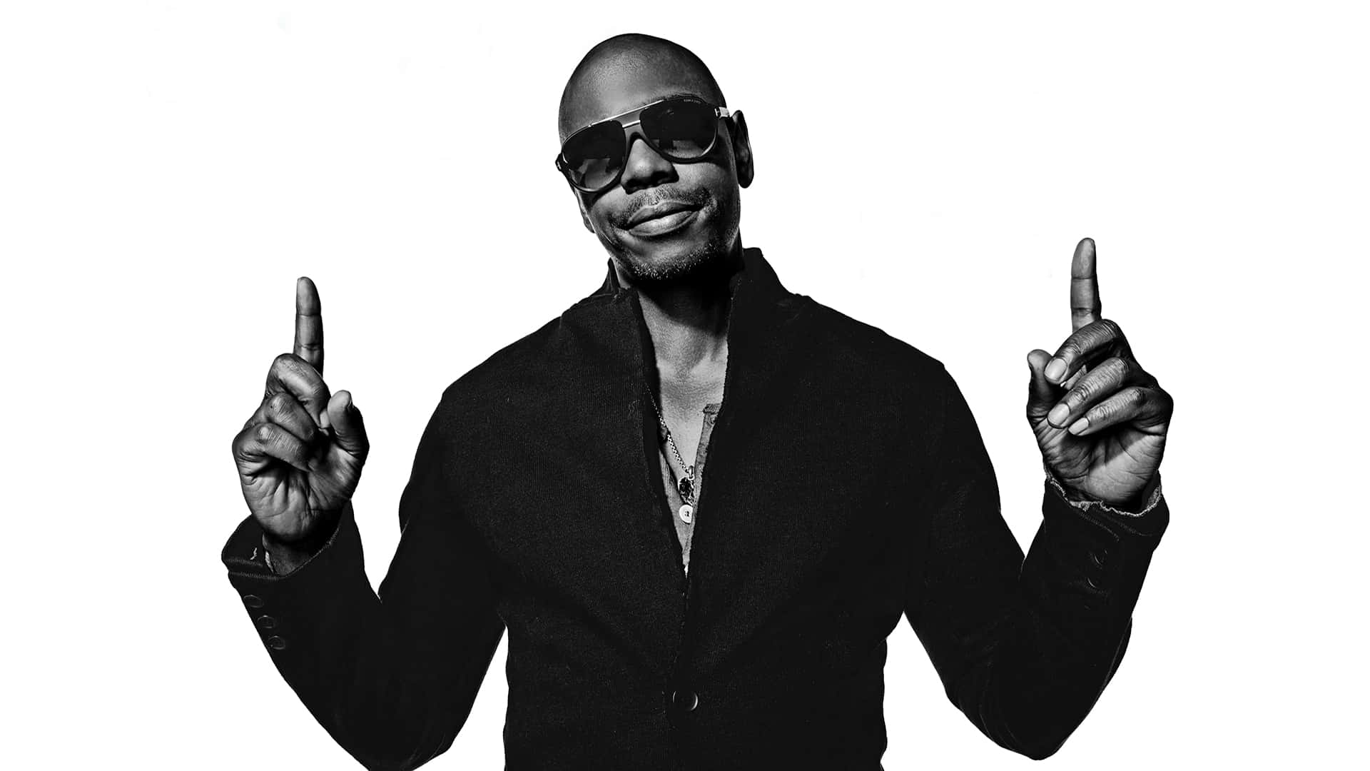 Legendary Comedian Dave Chappelle In Stand-up Performance Wallpaper