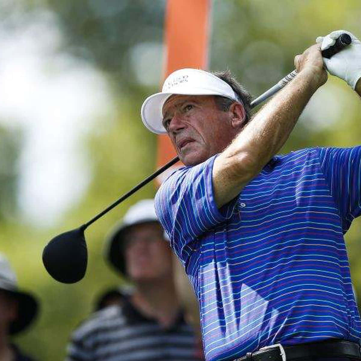 Legendary Golfer Joey Sindelar At The Height Of His Swing Wallpaper