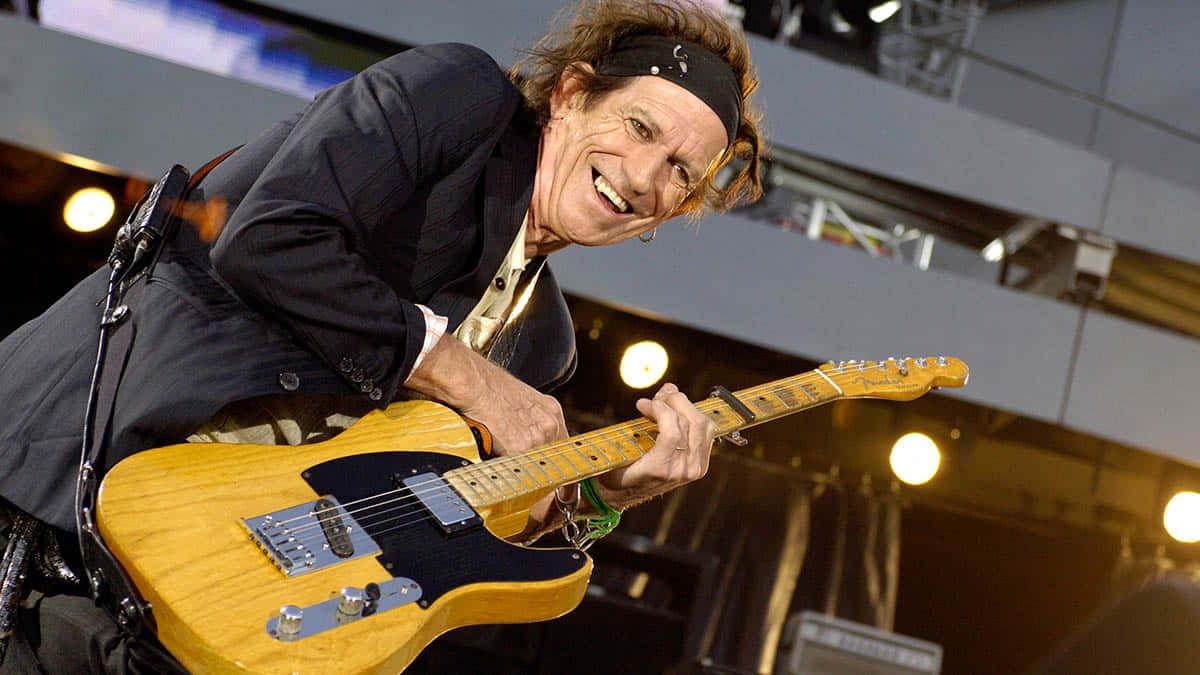 Legendary Guitarist Keith Richards Performing Live Wallpaper