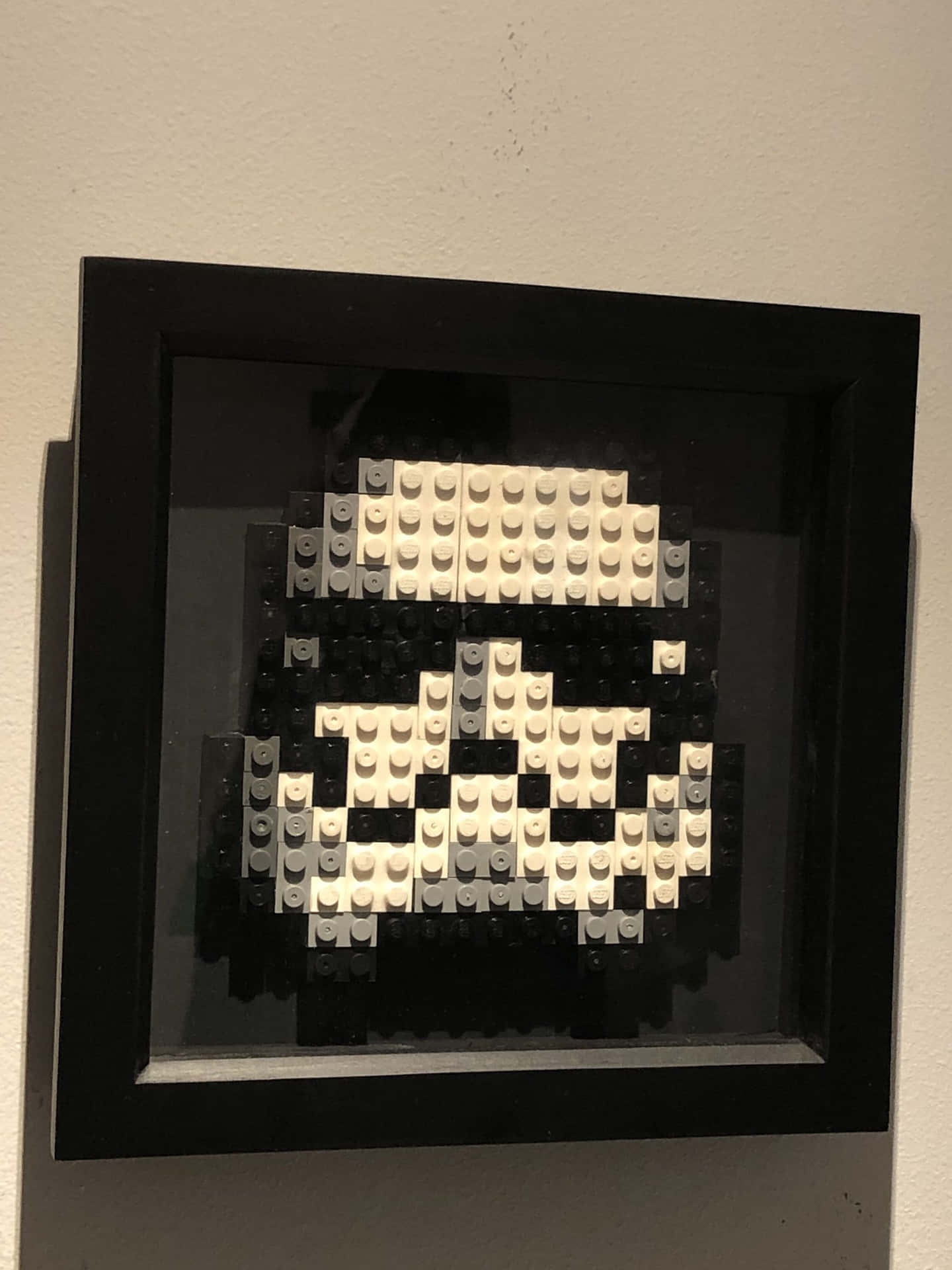 Unstormtrooper De Lego Está Enmarcado En Un Marco Negro.