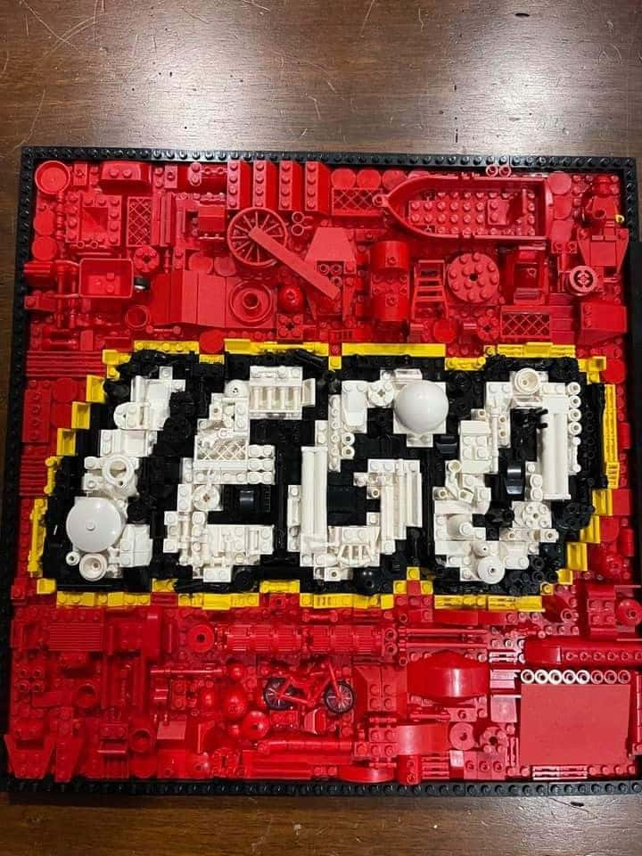 A Lego Piece With The Word Lego On It