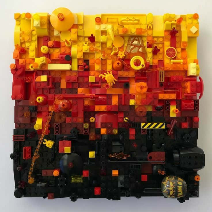 A Lego Piece With Red, Yellow And Orange Colors