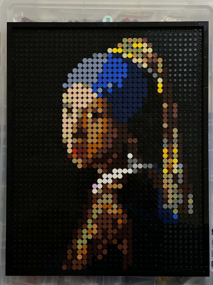 A Girl With A Pearl Earring Is Shown In A Lego Box