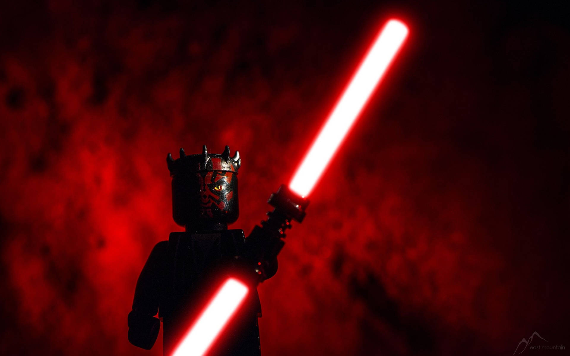 LEGO Darth Maul holds a double-bladed lightsaber Wallpaper