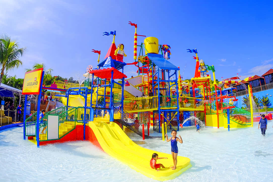 A Water Park With Many Slides And Water Slides