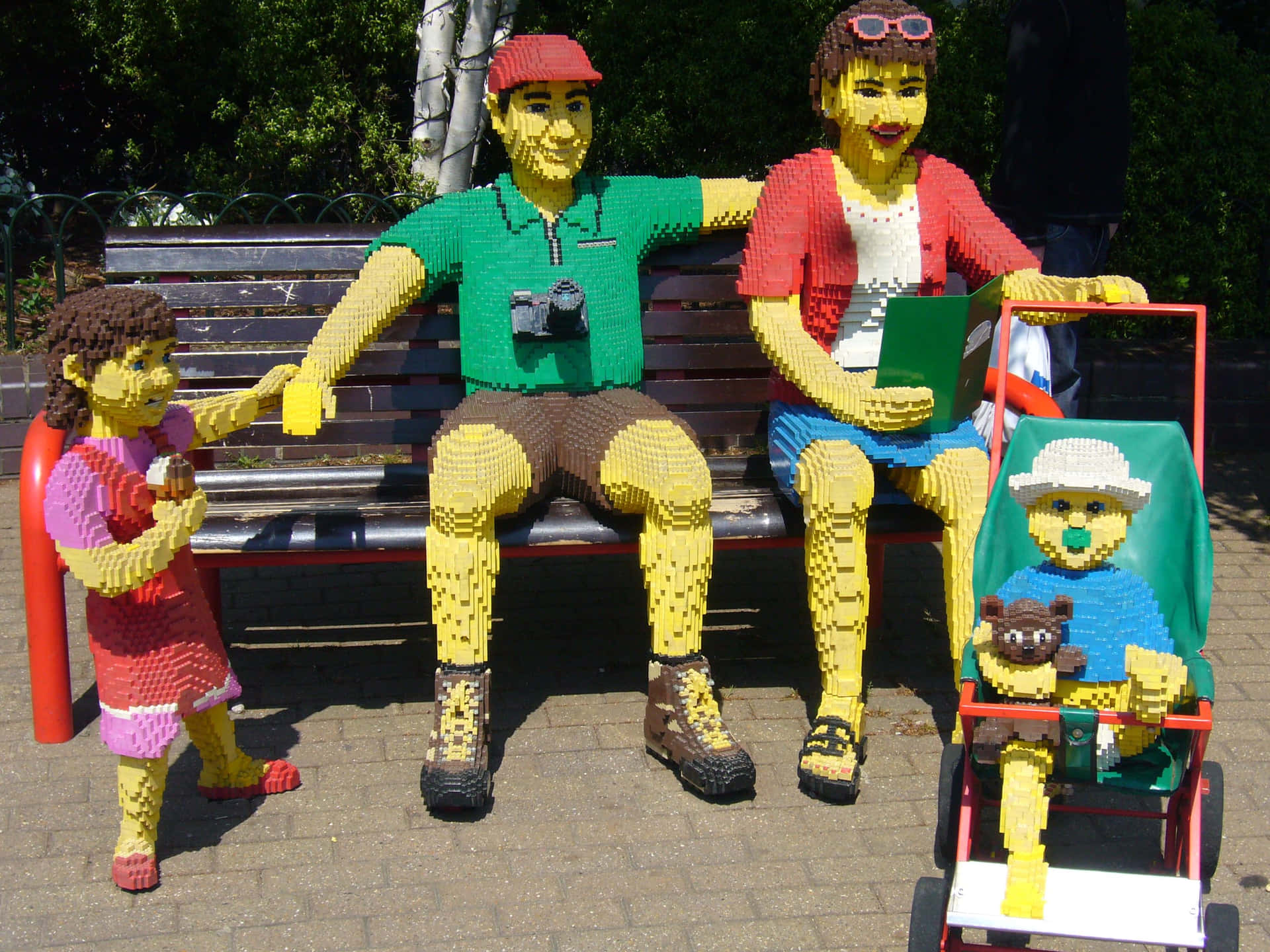 A Bench With A Lego Family On It