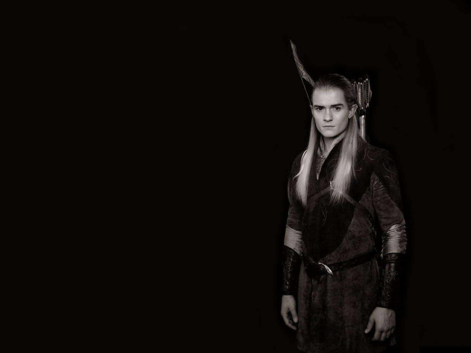 "Strategy and Skill: Legolas at the Heart of Combat" Wallpaper