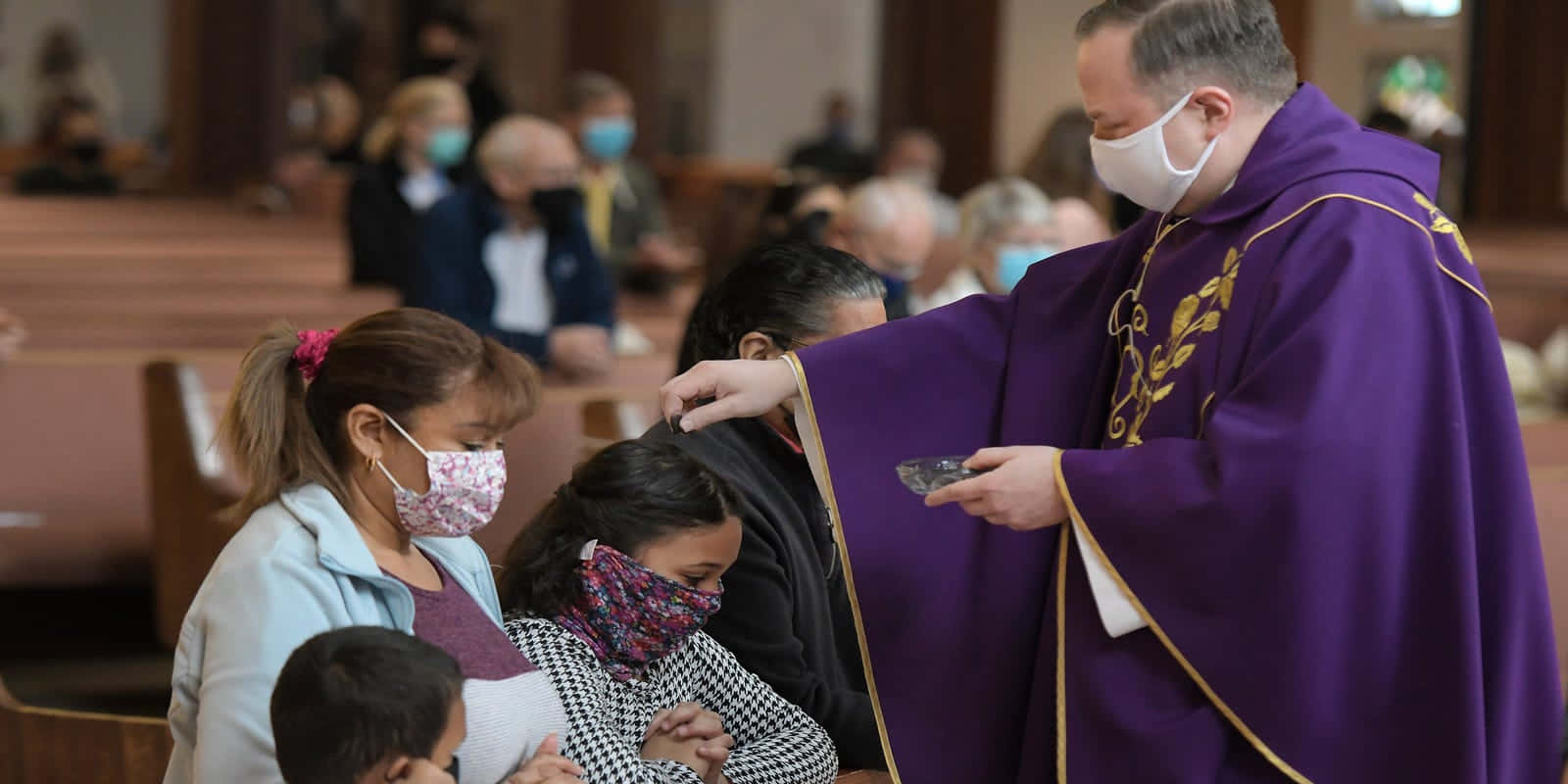 A Priest Is Wearing A Mask While He Is Preparing For A Mass
