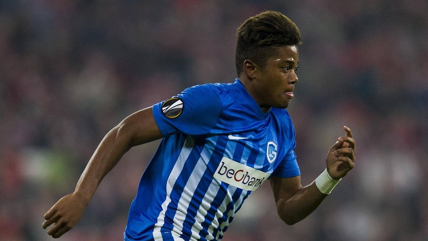 Striking pose of Leon Bailey, Professional Footballer, in a Blue Striped Jersey. Wallpaper