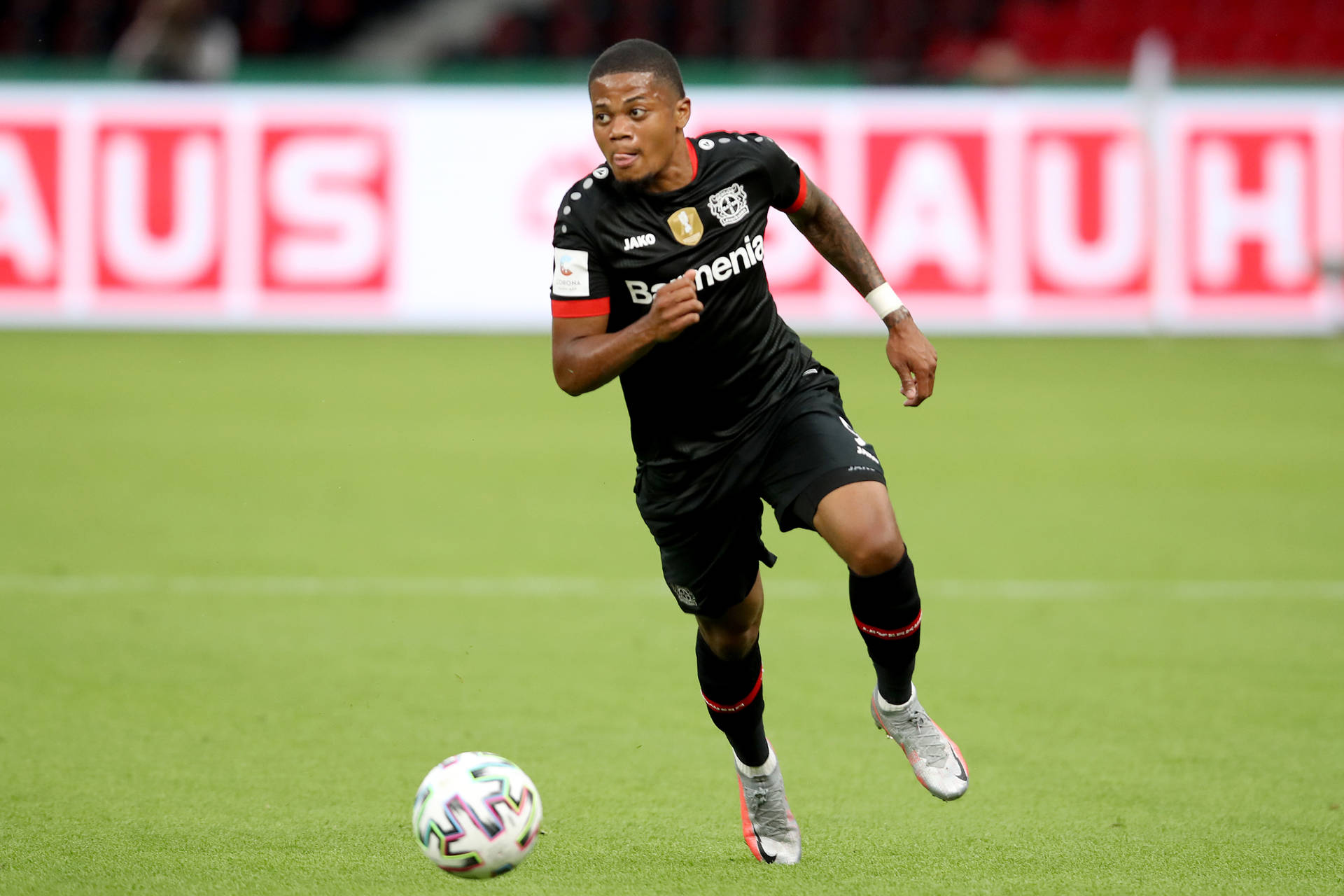 Leon Bailey Running With Ball Wallpaper