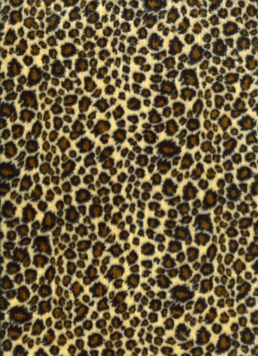 A Leopard Print Fabric With Black Spots Wallpaper