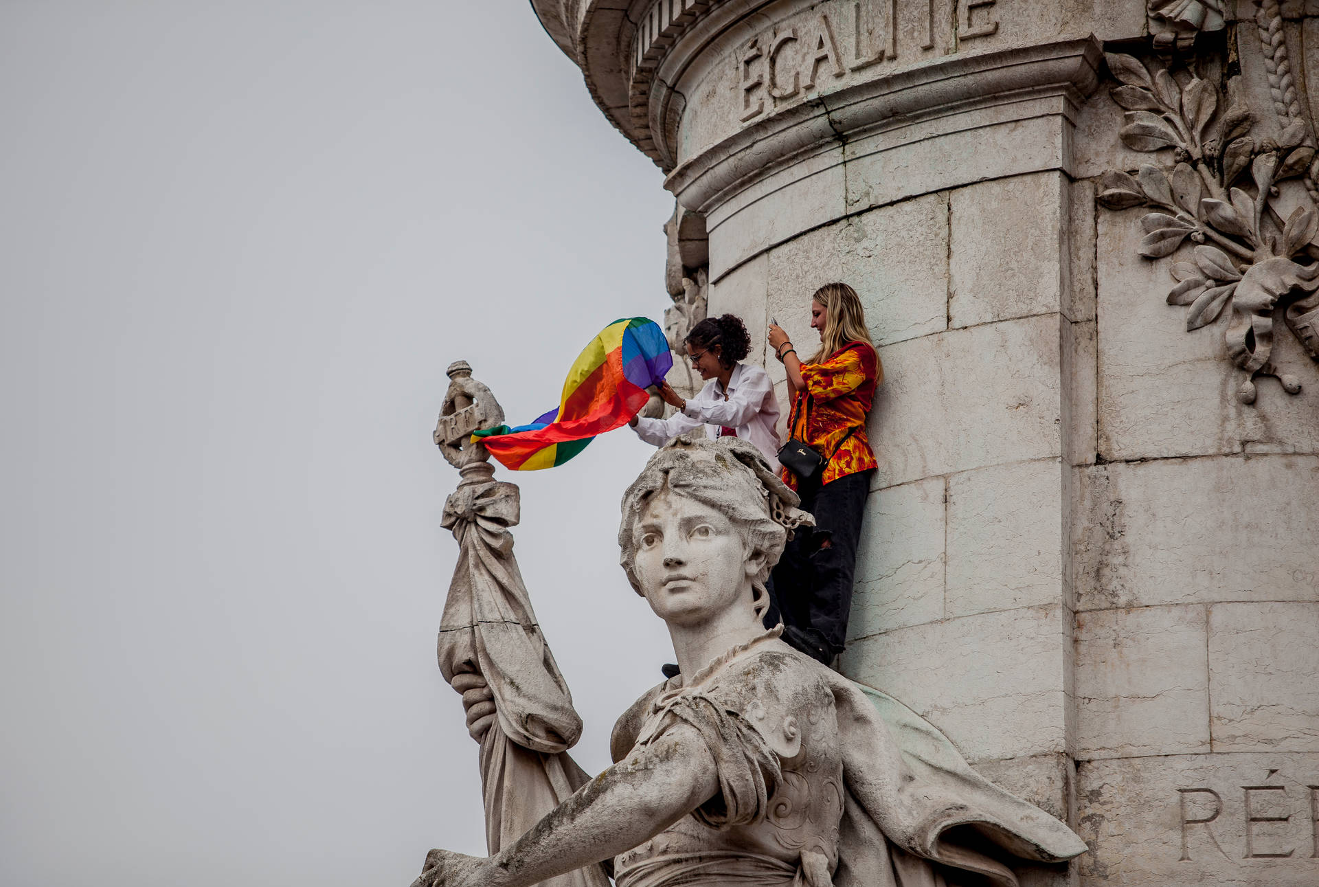 Lesbian Carrying Rainbow Flag