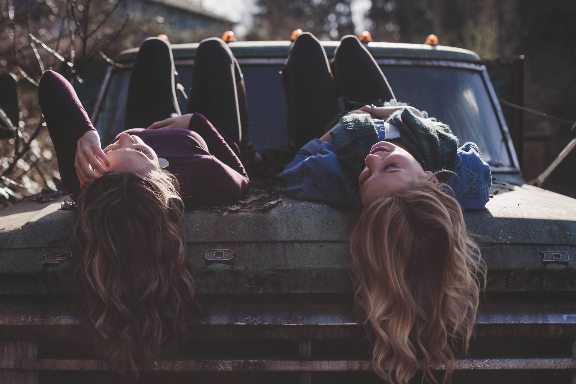 Lesbian Couple Laying On Truck