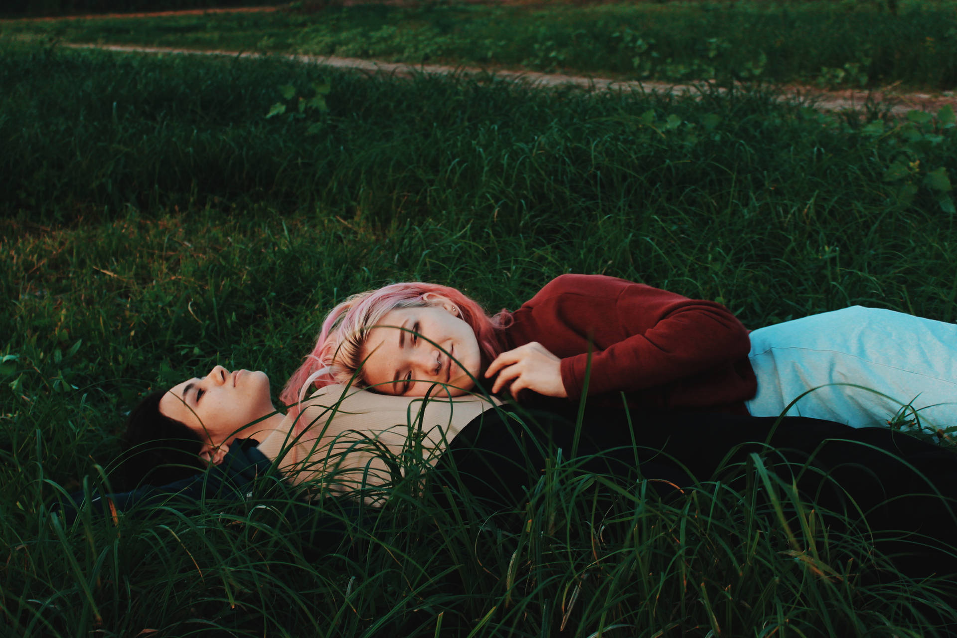 Lesbian Couple On Grass Field Wallpaper