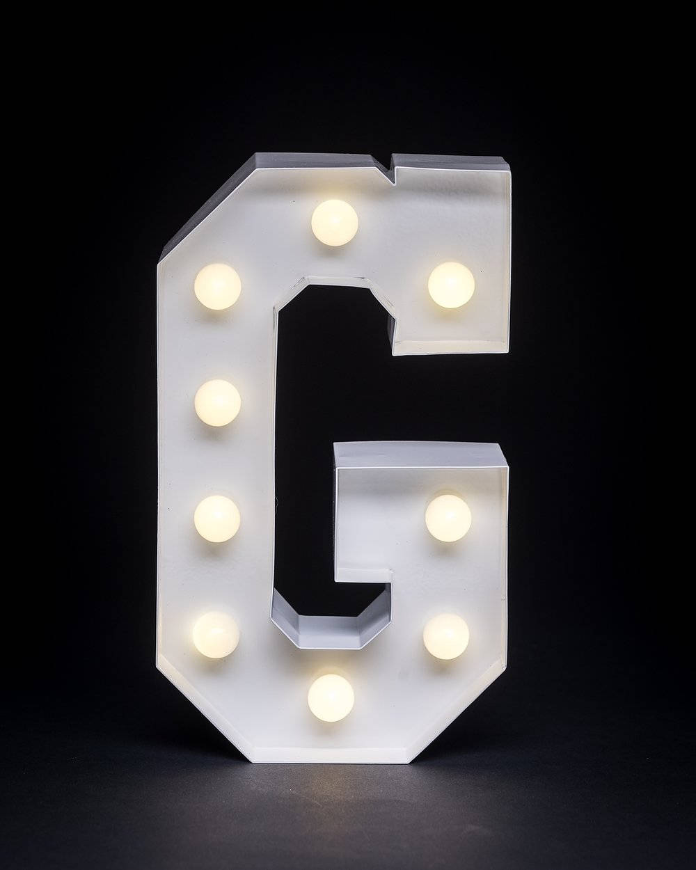 Glowing Letter G with Warm White Lights Wallpaper