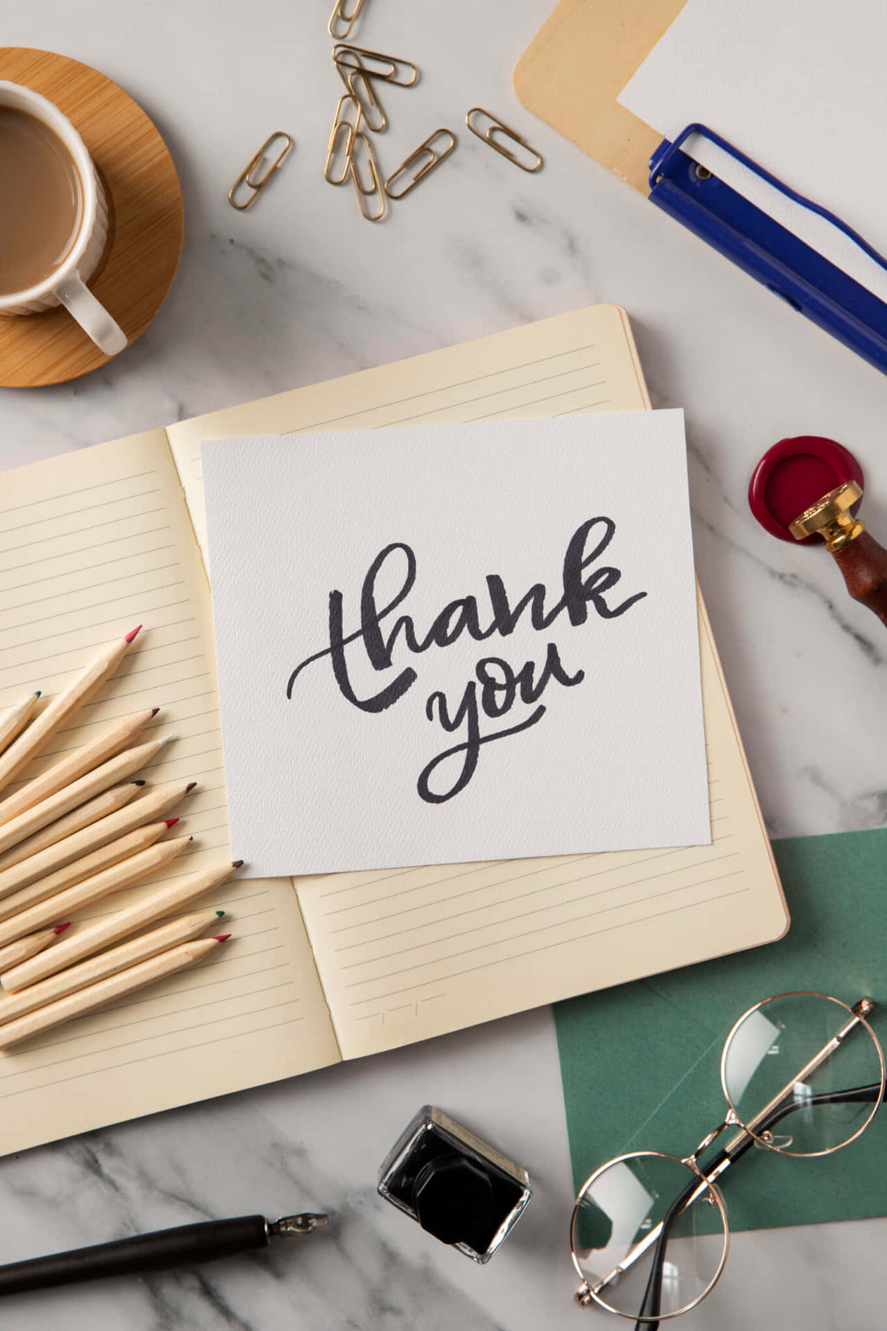 Thank You Card With Pens, Pencils, Glasses And A Notebook