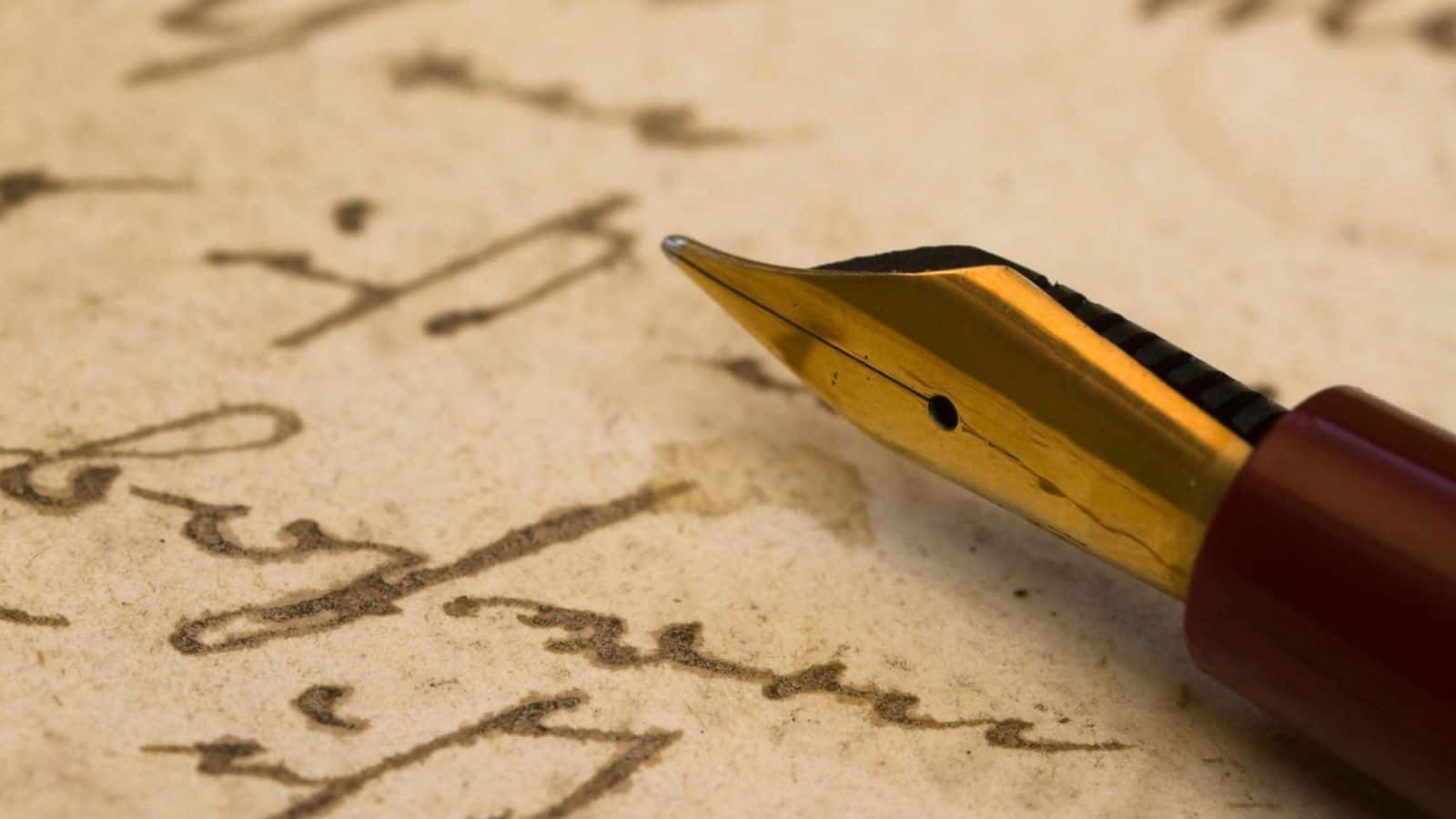 A Fountain Pen Is Sitting On Top Of An Old Letter