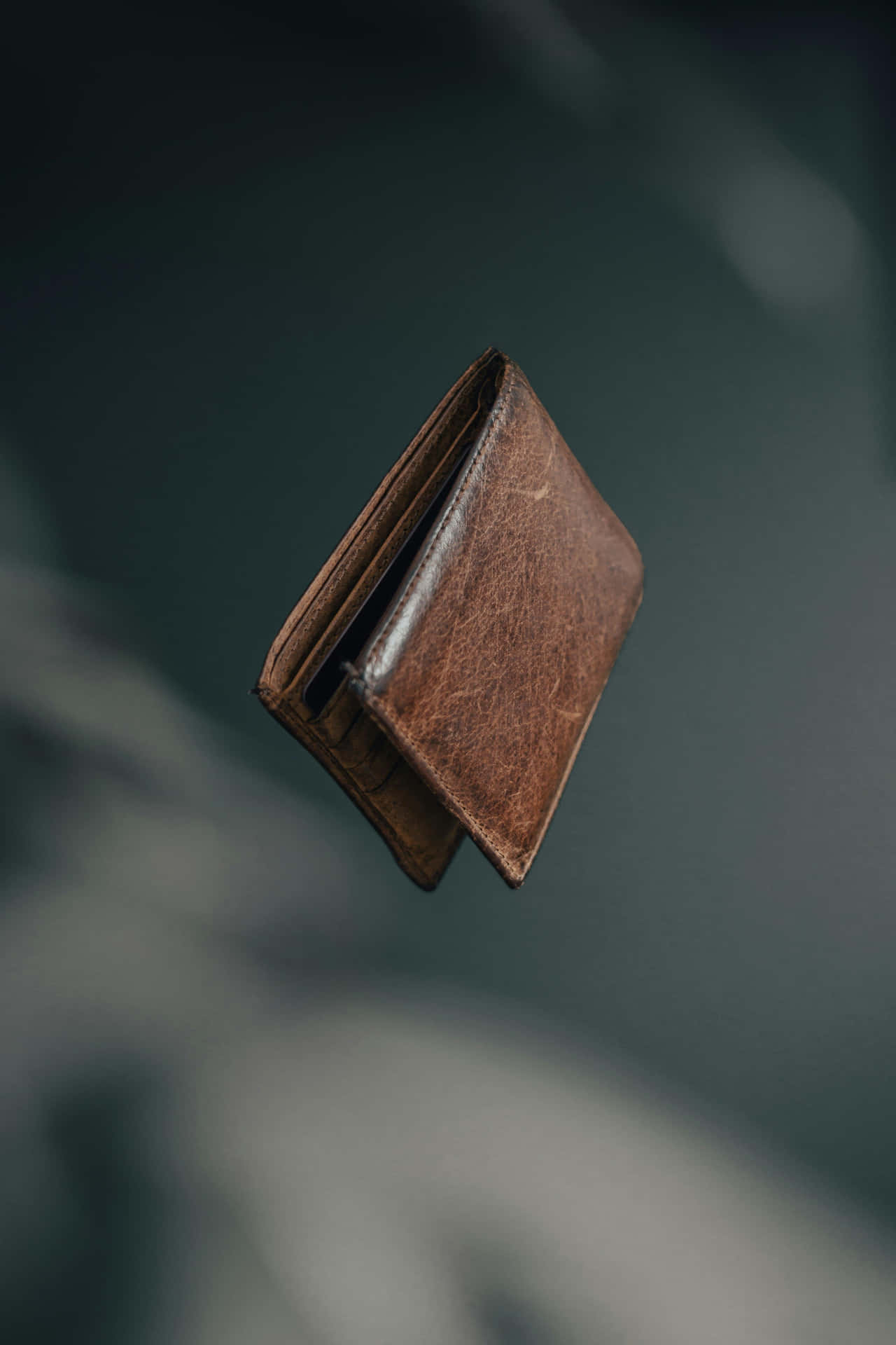 Levitating Brown Leather Wallet Wallpaper