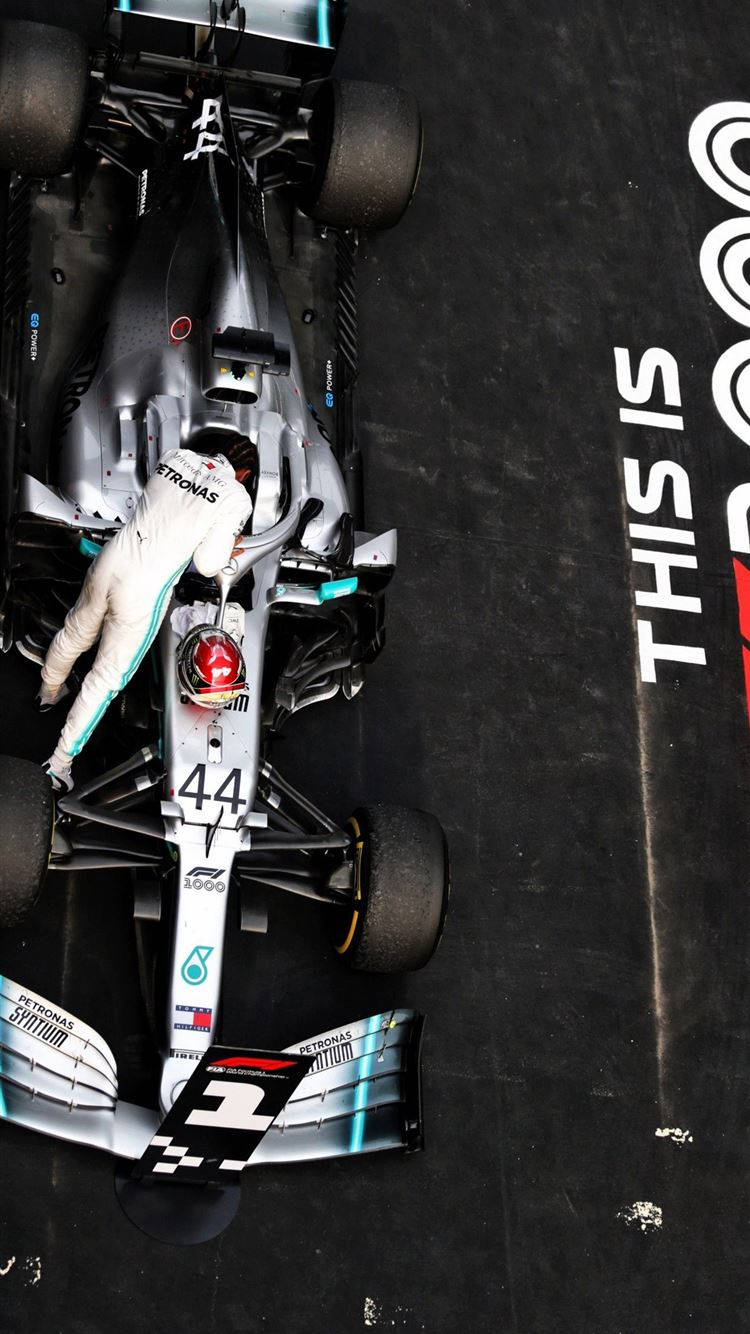 Lewis Hamilton Gearing Up Inside His Racing Cockpit Wallpaper