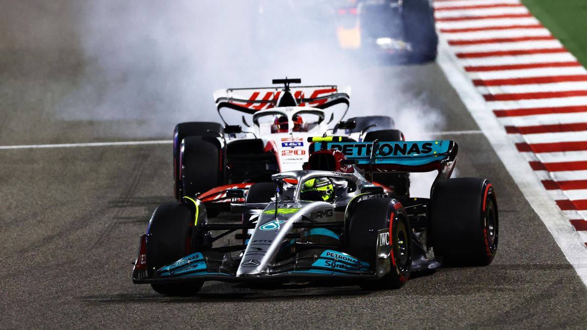 British F1 Champion Lewis Hamilton Showcasing Skills Wallpaper