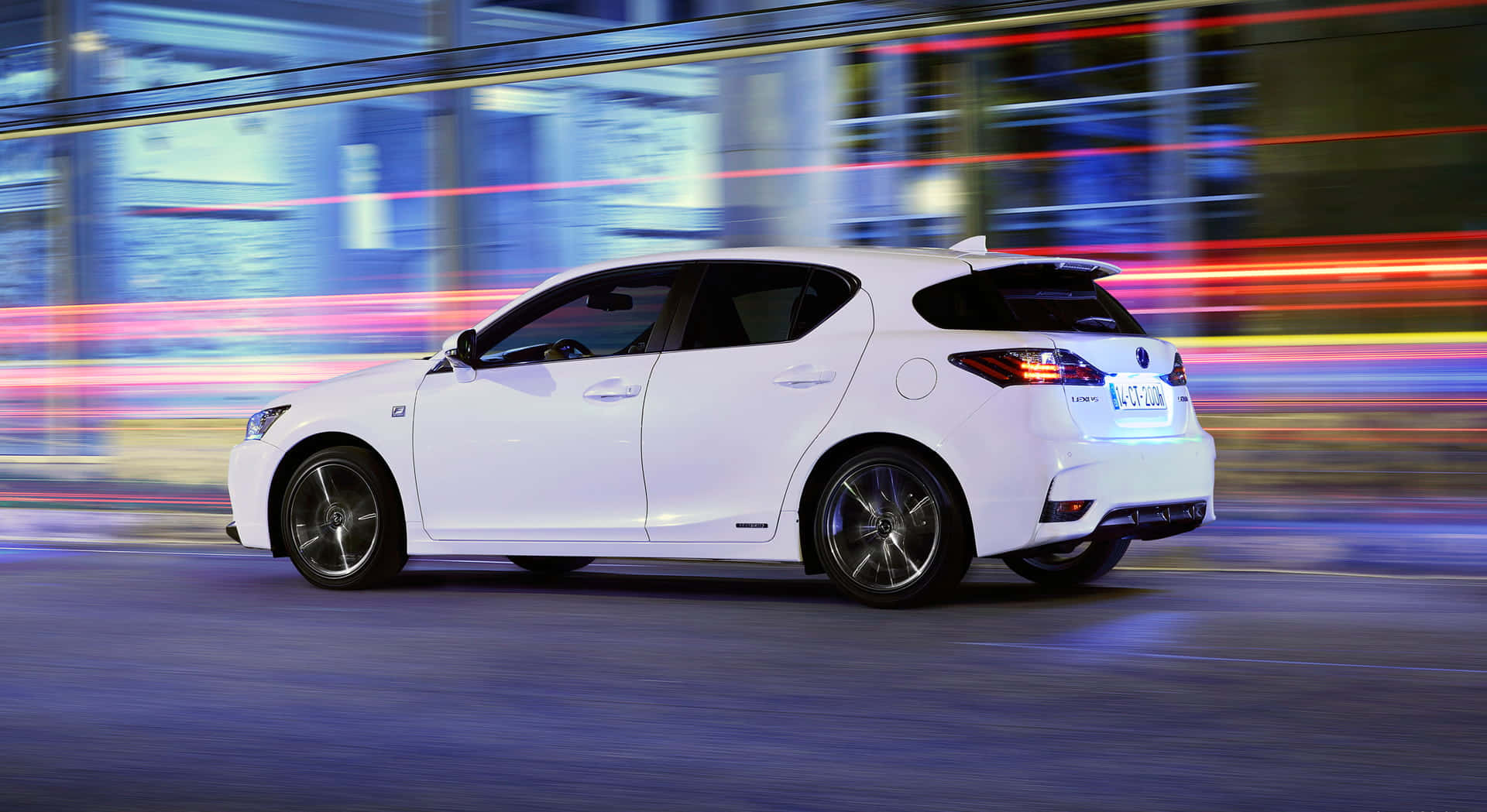 Elegant Lexus CT 200h in a City Setting Wallpaper