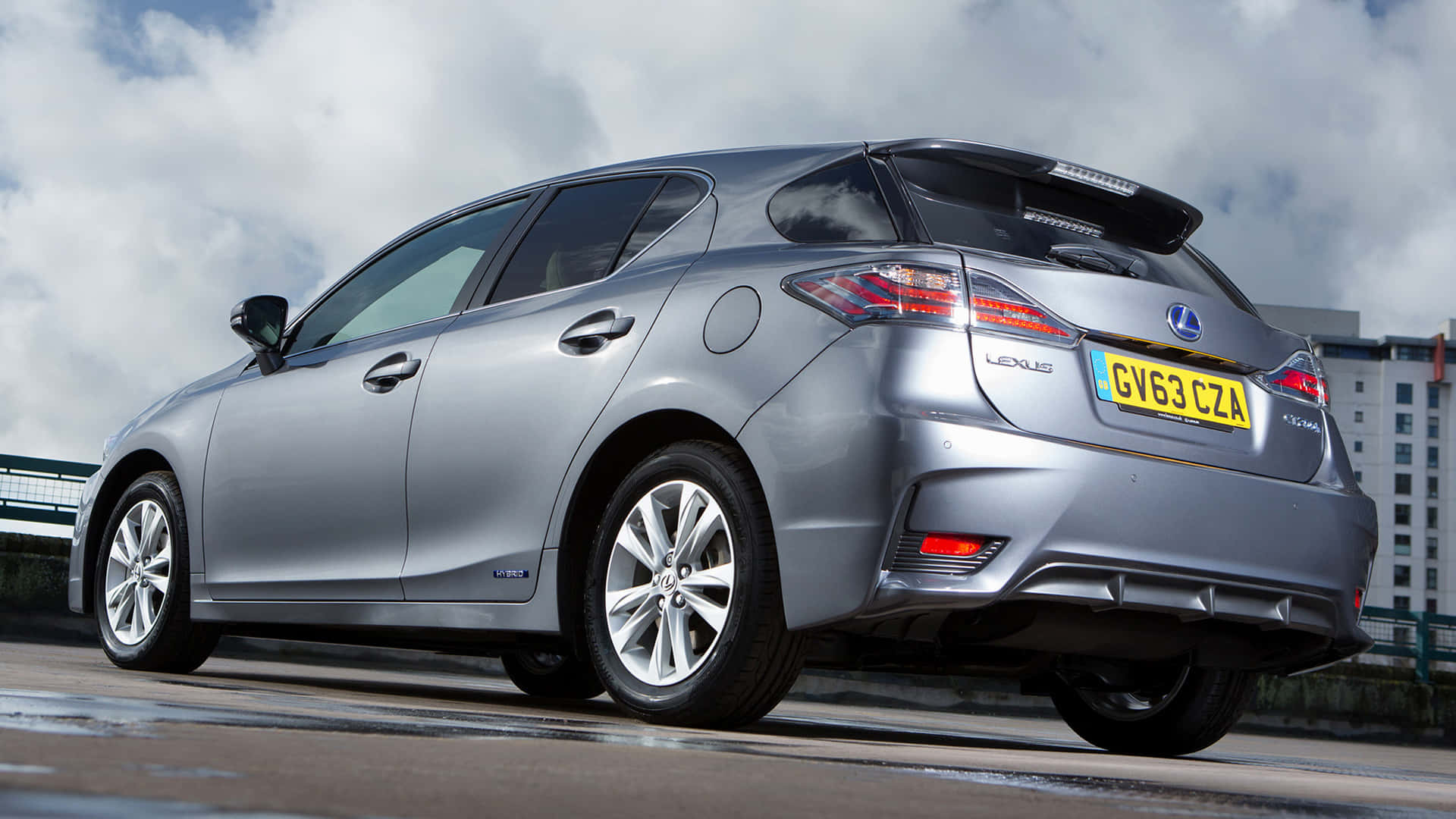 Sophisticated Lexus CT 200h in a Scenic Cityscape Wallpaper