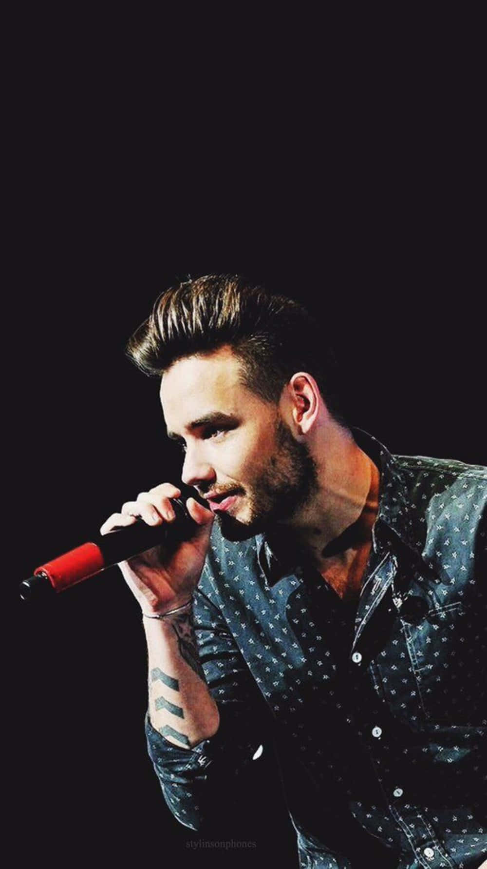 Liam Payne rocks the stage with his electrifying performance. Wallpaper