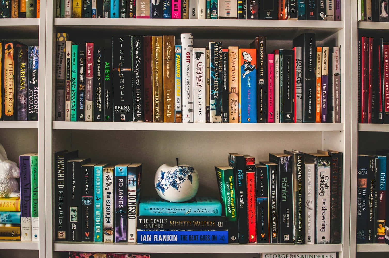 A Book Shelf With Many Books