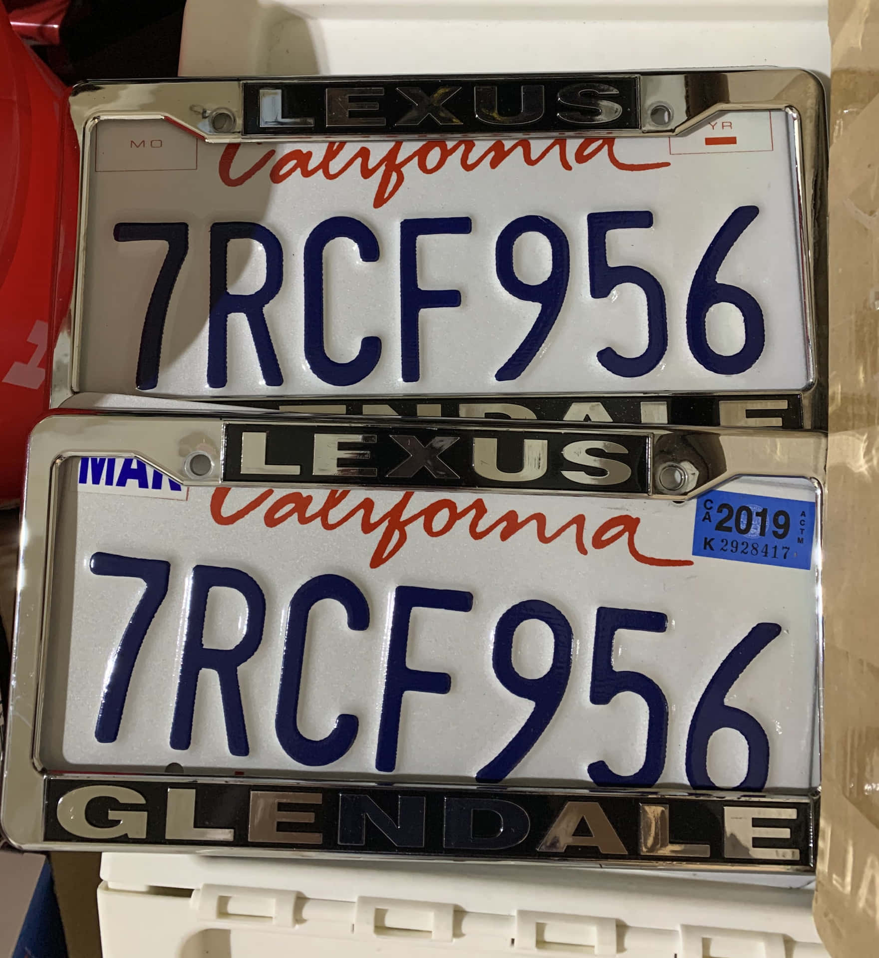 Two License Plates Are In A Box