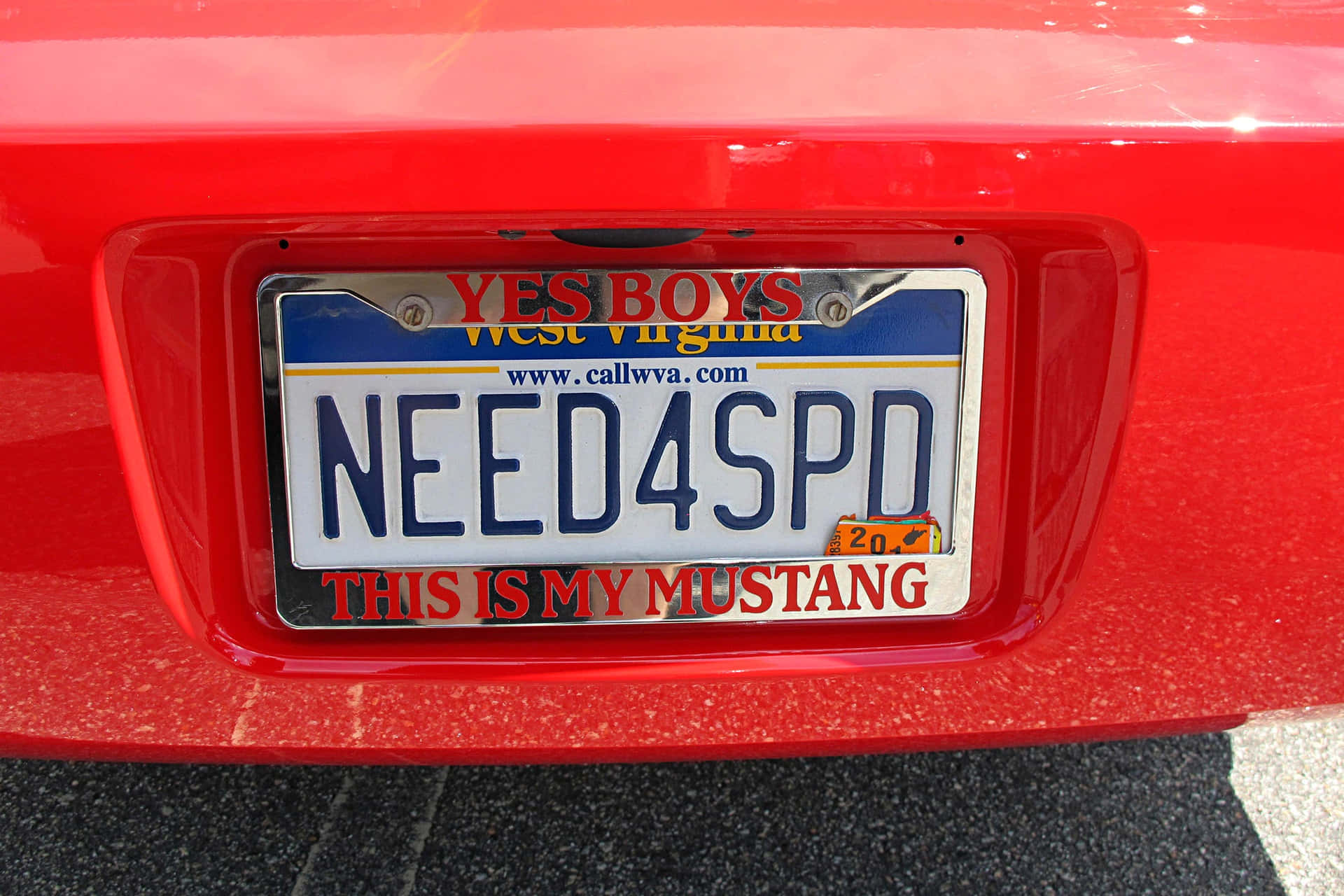 A Red Car With A License Plate