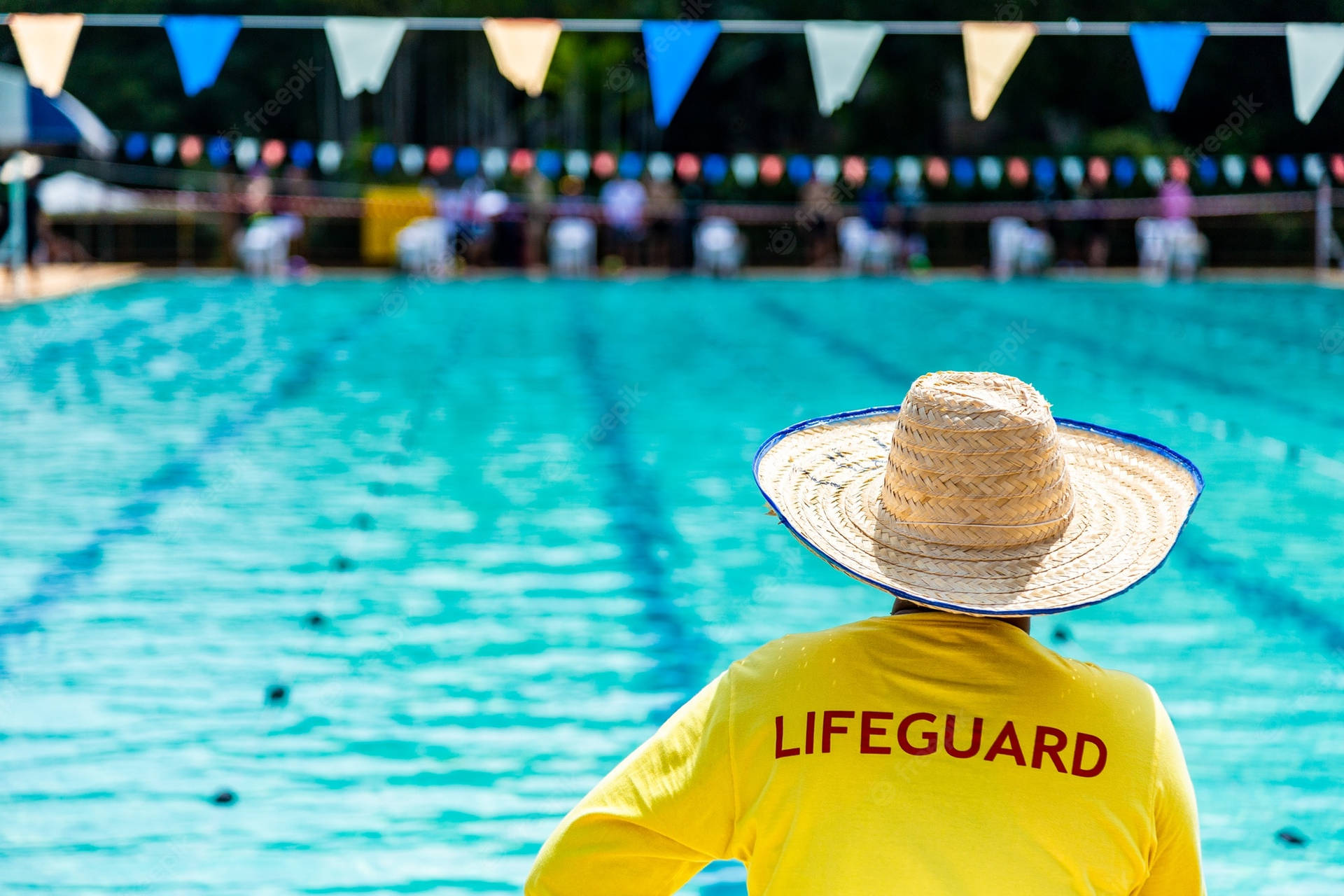 Lifeguard On Duty With Straw Hat Wallpaper