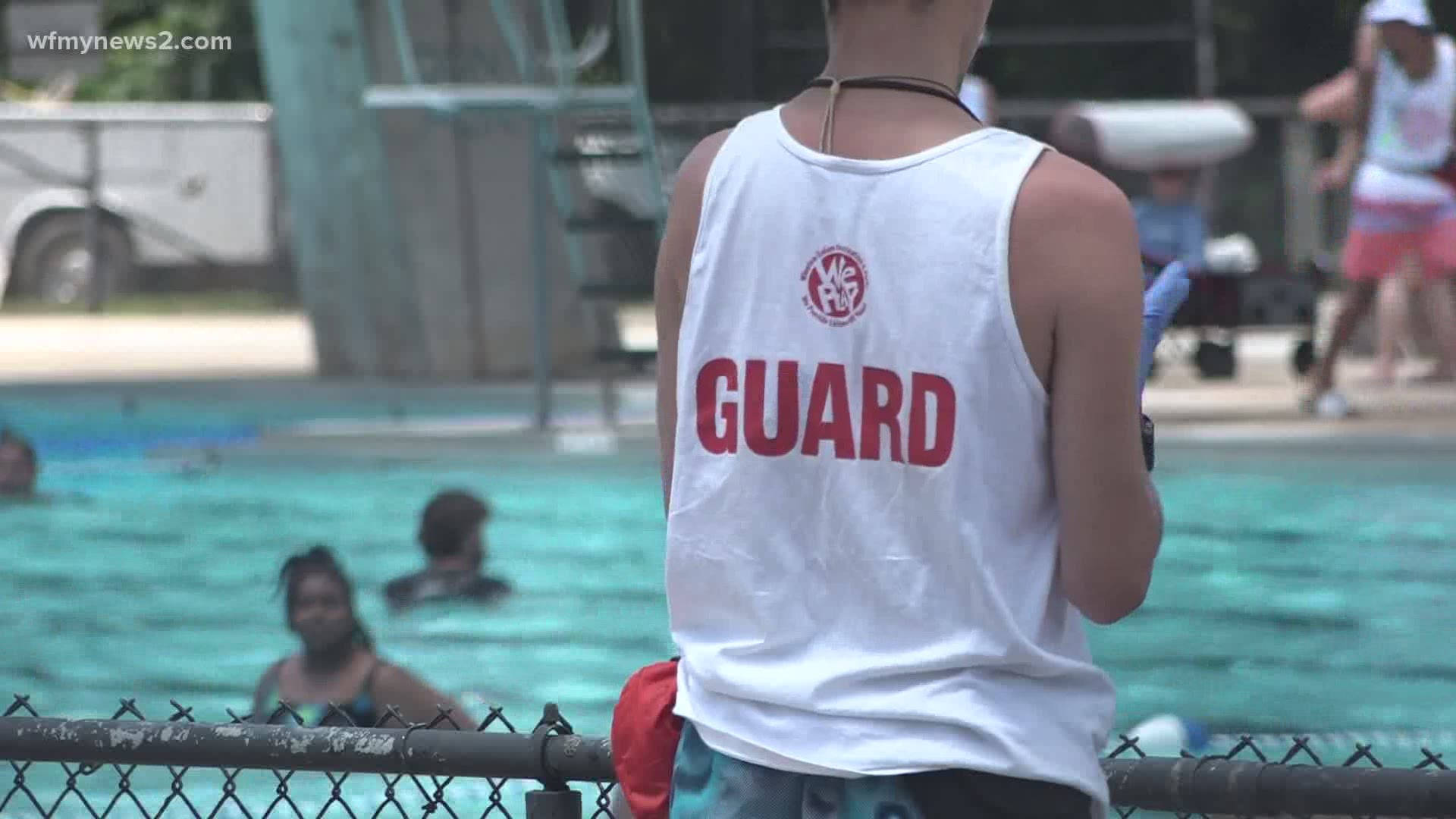 Lifeguard Watching Over Swimming Pool Wallpaper