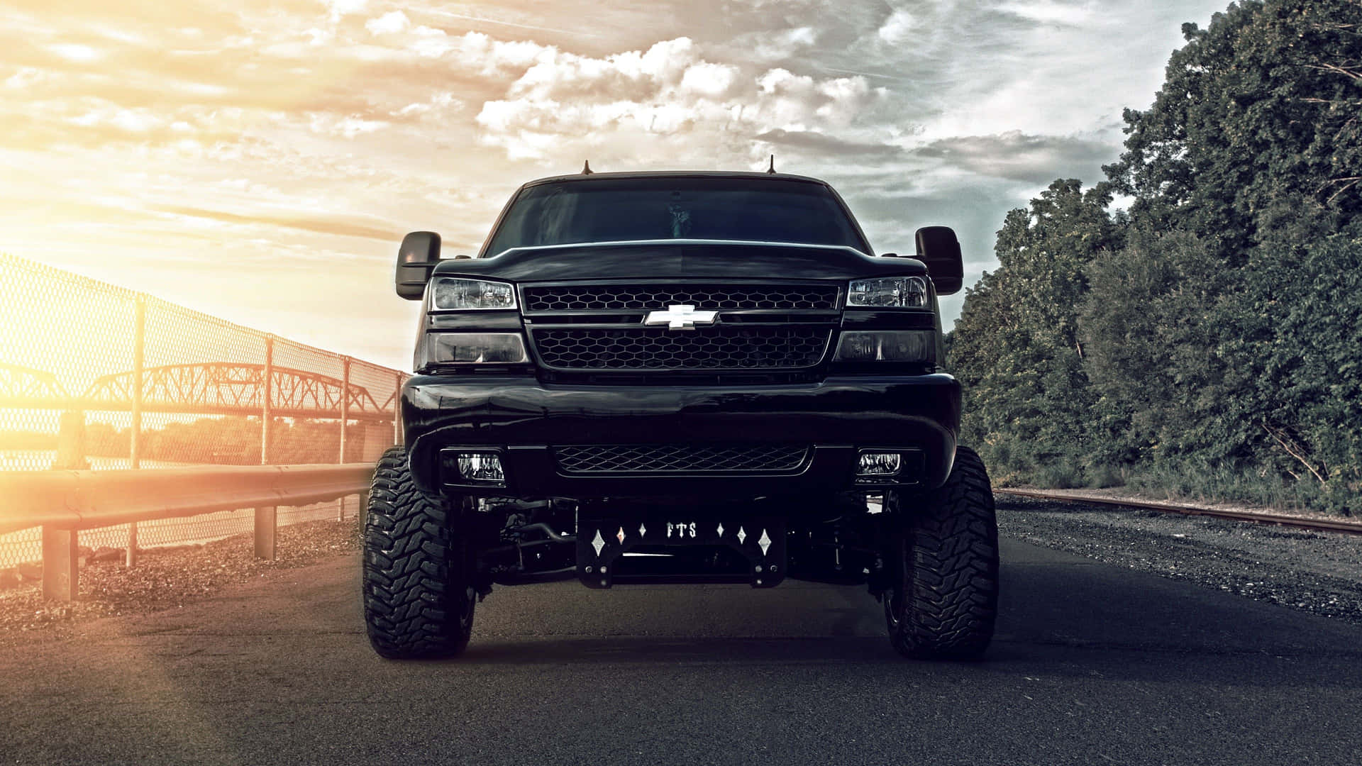Black Lifted Truck Full Front View Wallpaper