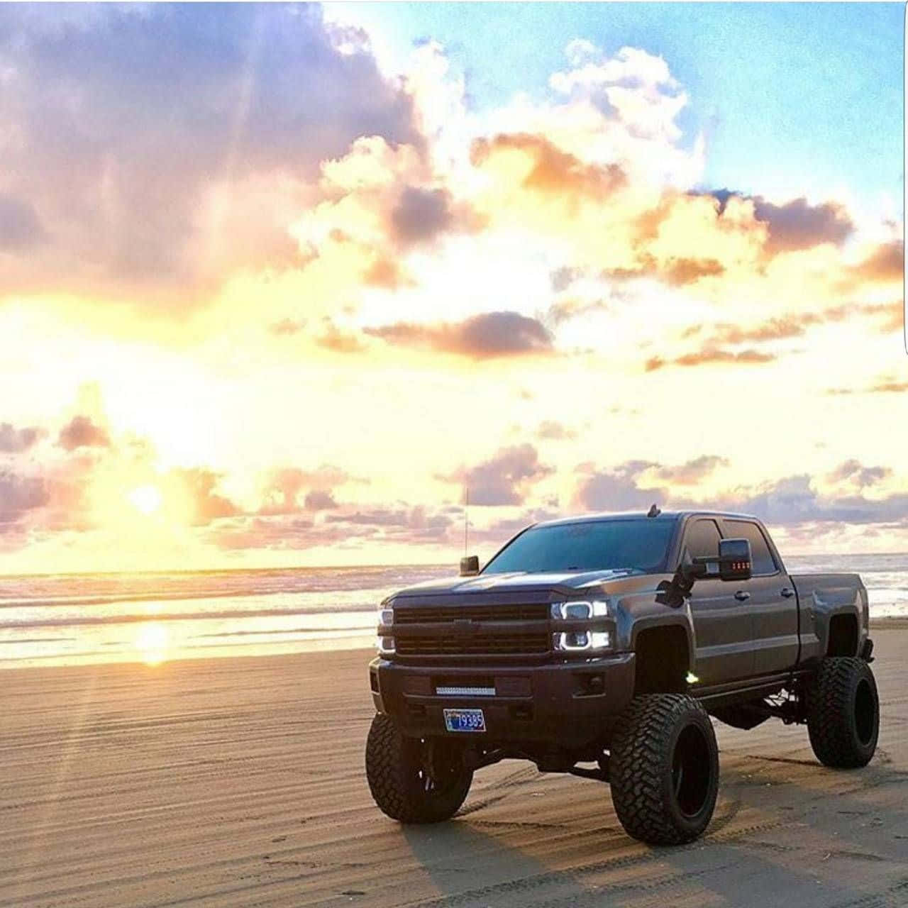 Black Lifted Truck On The Beach Wallpaper