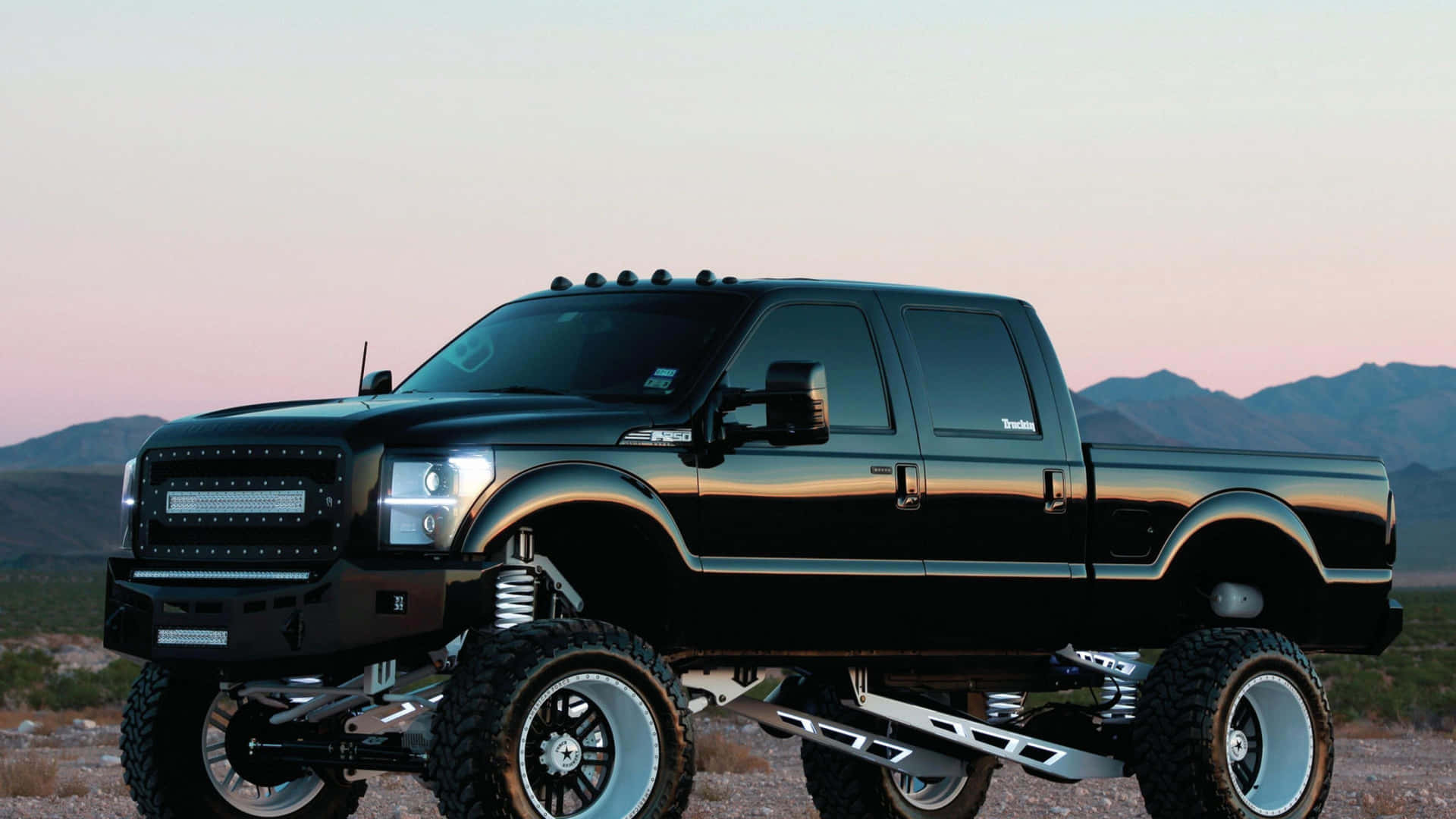 Black Lifted Truck Side View Wallpaper