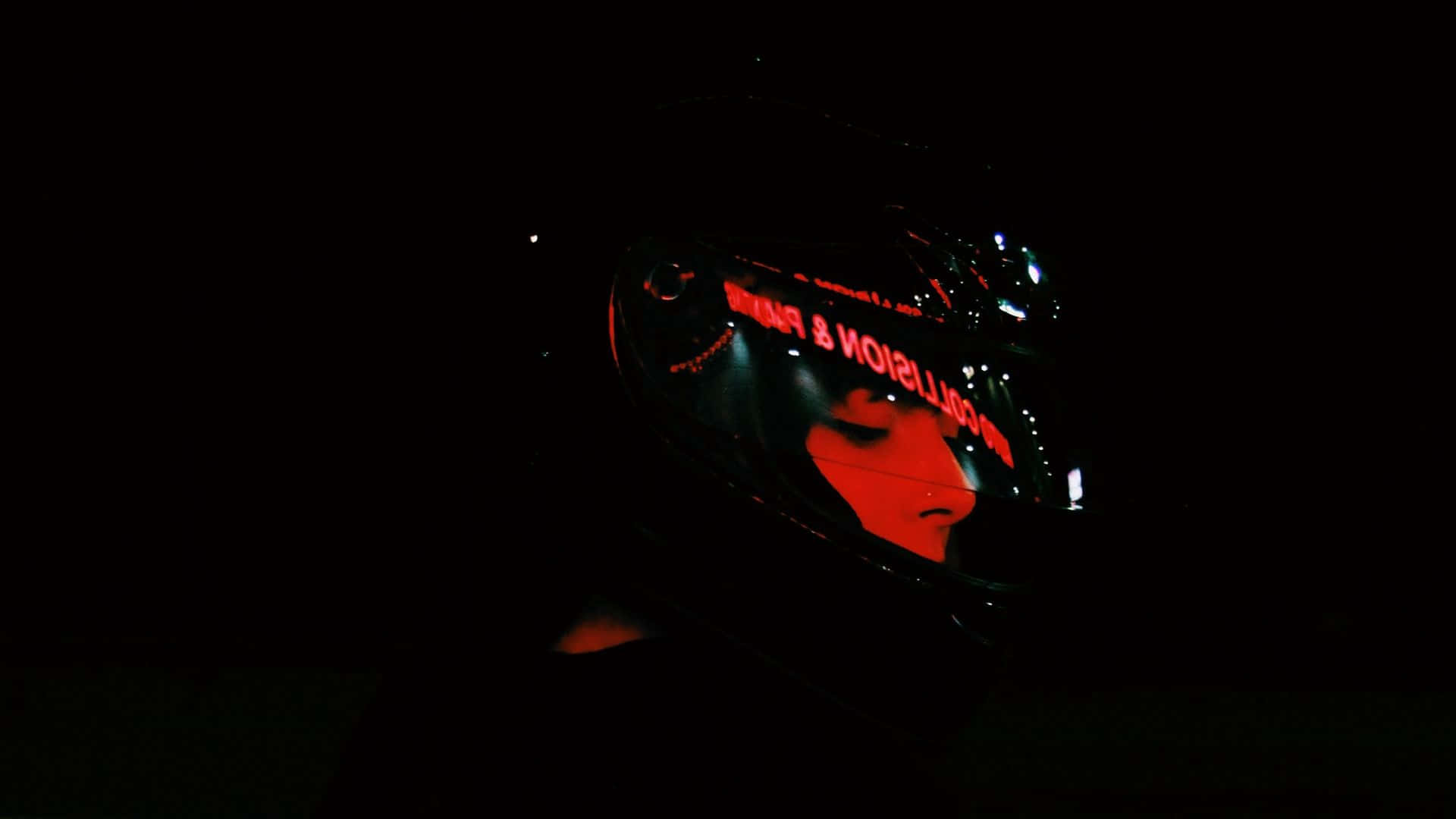 A Person Wearing A Helmet At Night