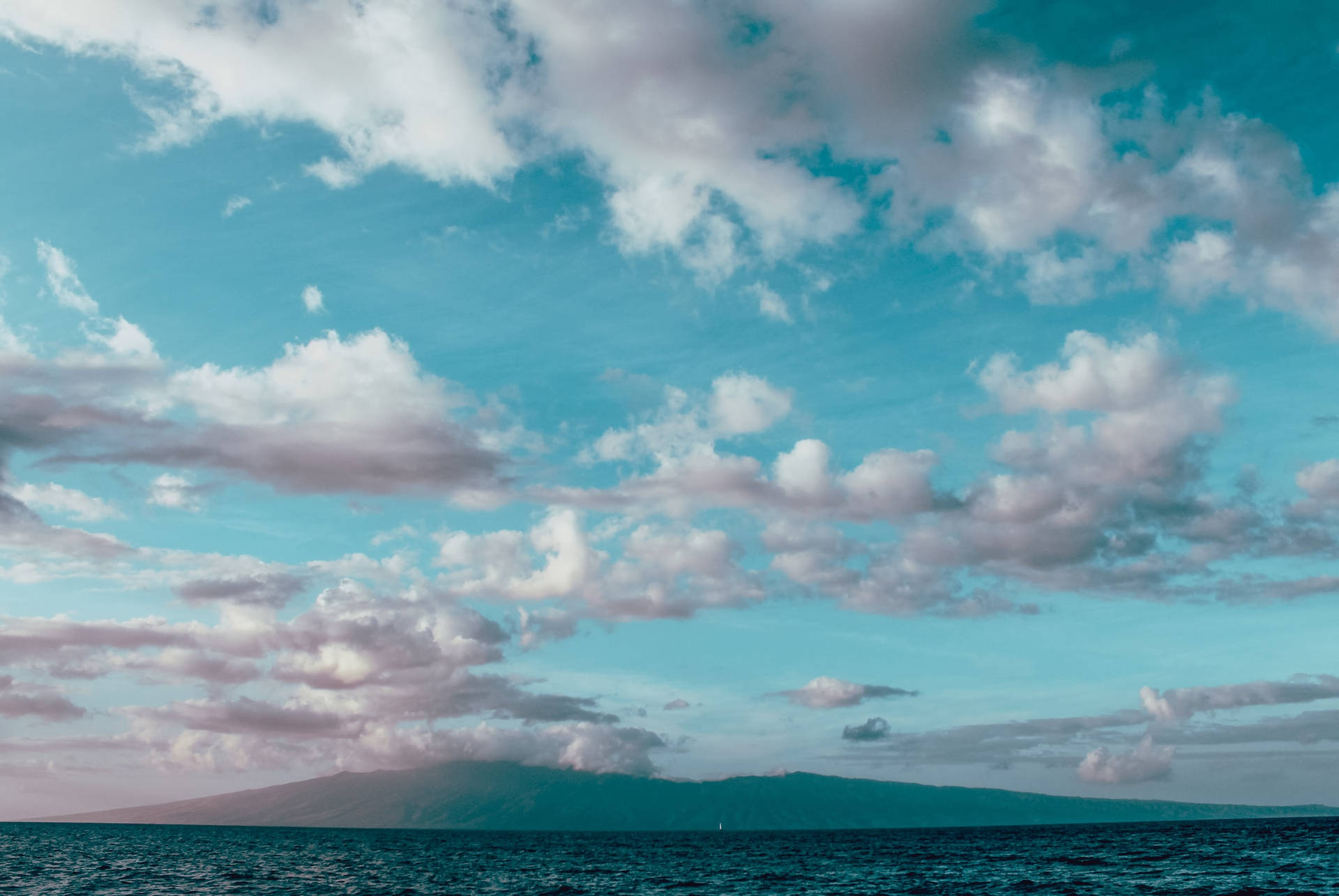 Light Blue Ocean With Cloudy Sky Wallpaper